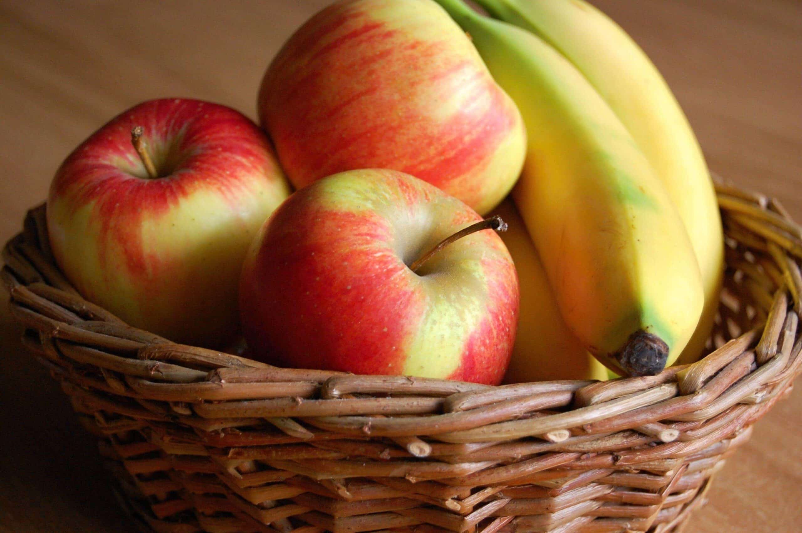 Basket of bananas and apples