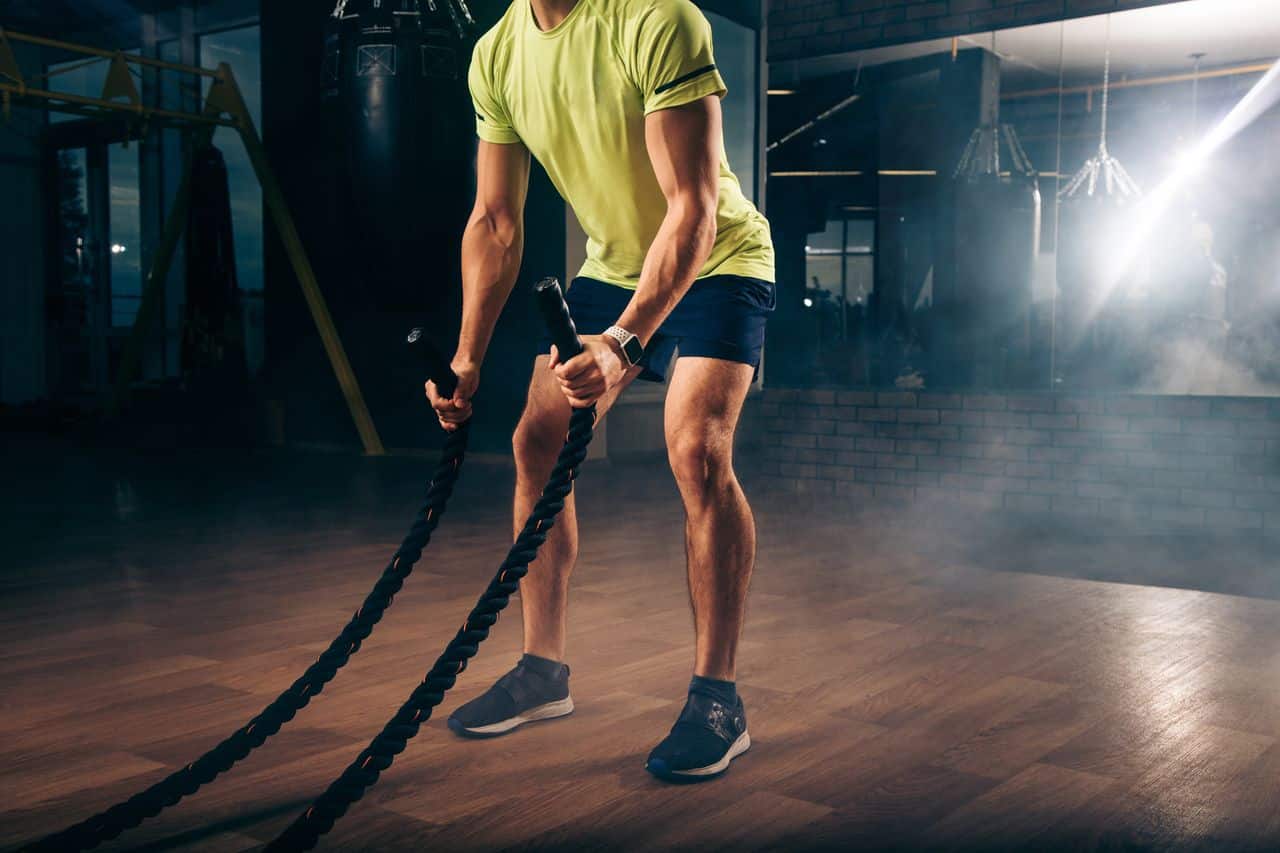 Premium Photo  Rope workout sport man doing battle ropes exercise